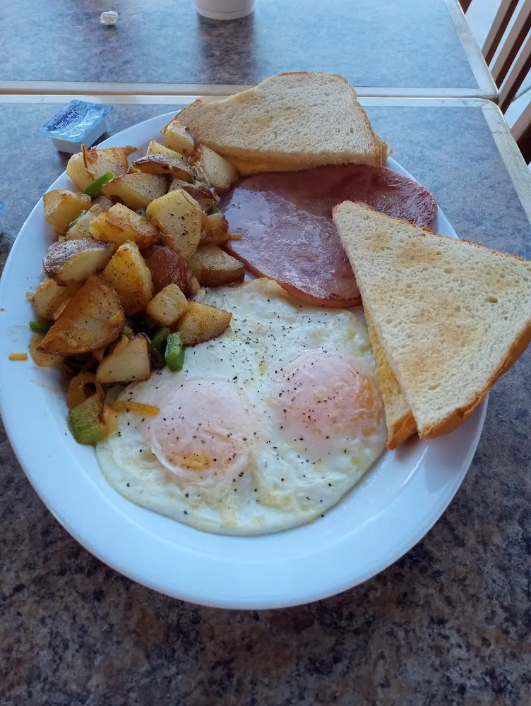 95 Two Eggs Any Style Choice of Ham Bacon or Sausage with Hashbrowns and Toast