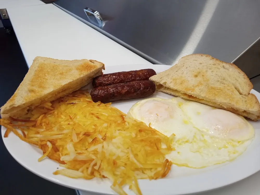 95 Two Eggs Any Style with Bacon Ham or Sausage with Hash Browns and Toast